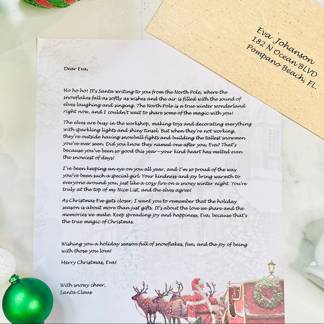 Letter from Santa Claus with a personalized address on a festive background with Christmas decorations.