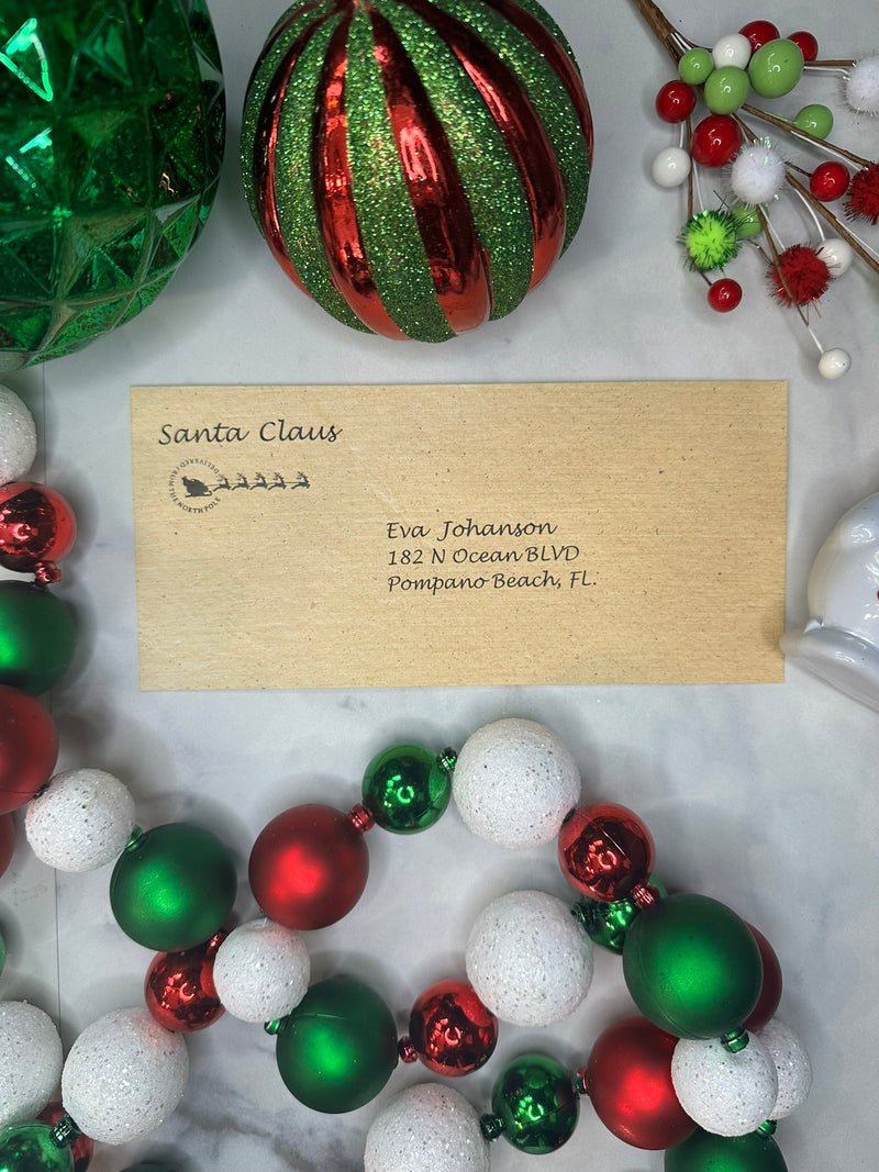 Kraft envelope from Santa Claus addressed to Eva Johanson with festive ornament garland